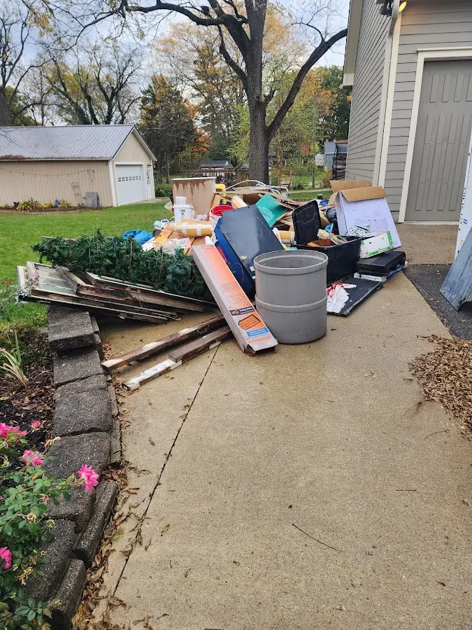 Dumpster being loaded with debris for 30 Yard Dumpster Rental in Pleasant Valley